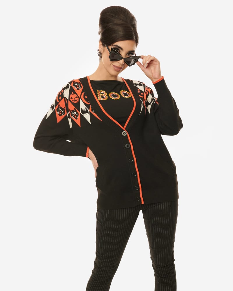 Front of a model wearing a size 2X/3X Unique Vintage Halloween Argyle Button Cardigan in Black by Unique Vintage. | dia_product_style_image_id:301909